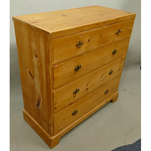 754 - A 19th Century pine straight front chest of drawers with 2 short, 3 long graduated drawers with drop... 