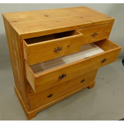 754 - A 19th Century pine straight front chest of drawers with 2 short, 3 long graduated drawers with drop... 