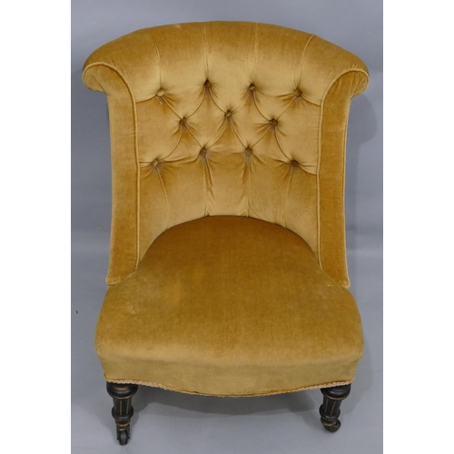 755 - An ebonised nursing chair with yellow velvet over stuffed seat and button back, on turned legs with ... 