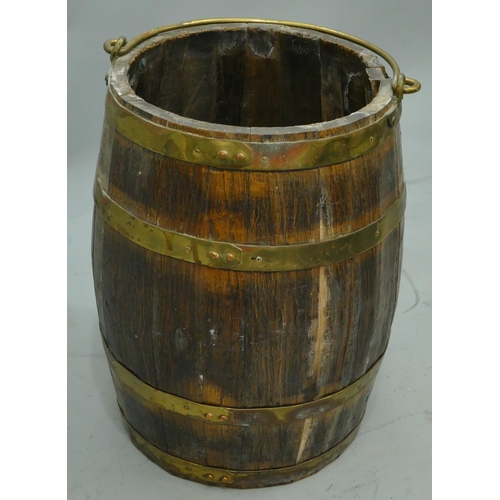 758 - An oak and brass bound round bulbous shaped bucket with swing overhead handle, 44.5cm high.