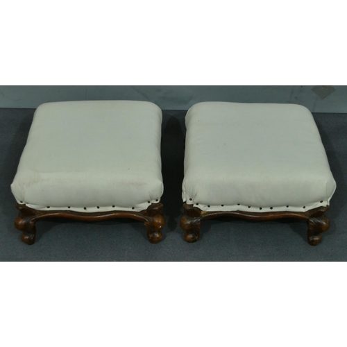 763 - A pair of walnut square footstools with white overstuffed seats on short cabriole legs, 31.5cm wide.