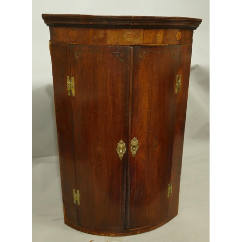 765 - A George III mahogany bow fronted hanging corner cupboard with marquetry inlaid shell and stringing ... 