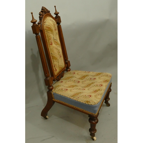 770 - A 19th Century walnut nursing chair with reeded support, needlework overstuffed seat and part back, ... 