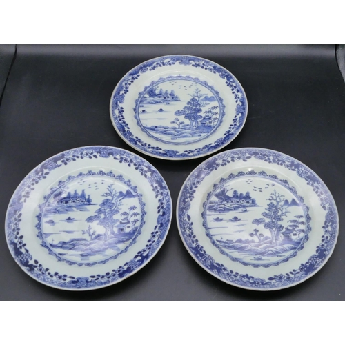 81 - A set of 3 18th Century Chinese blue and white plates depicting river and landscape (slight chips to... 