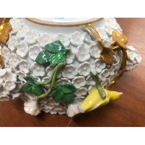 187 - A Meissen lidded pot with all over raised encrusted floral and branch decoration, mounted with 4 yel... 