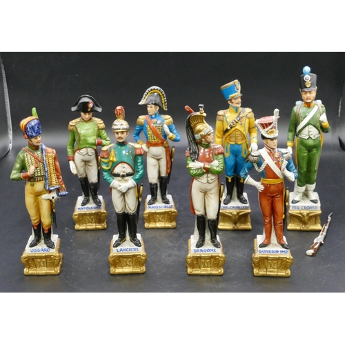 102 - A set of 8 Naples china figures of various military gentlemen 