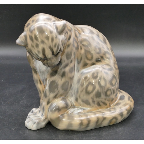 105 - A Royal Copenhagen figure of a seated snow leopard, number 2555, 20.5cm high