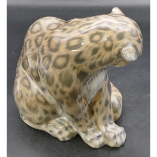 105 - A Royal Copenhagen figure of a seated snow leopard, number 2555, 20.5cm high