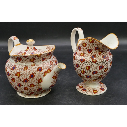 106 - A 19th Century Pearlware round bulbous shaped teapot and matching cream jug on white and red ground ... 