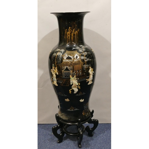 116 - A large reproduction Oriental round bulbous thin necked trumpet shaped floral vase on black ground w... 