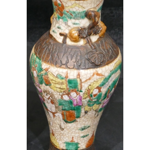 117 - An Oriental crackleware round bulbous lidded ginger jar with multi-coloured warrior decoration, 14.5... 