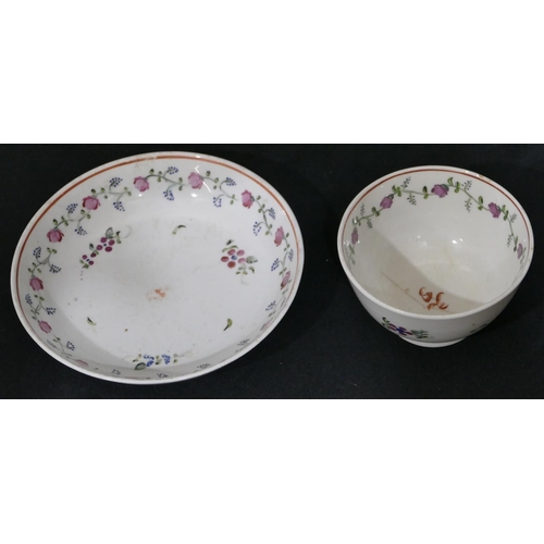 119 - A early 19th Century Newhall tea bowl and saucer on white ground with puce, blue and green floral le... 