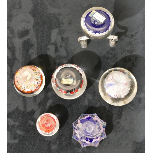 127 - A Strathearn millefiori paperweight mounted with 2 candlesticks, 5 other millefiori paperweights (6)