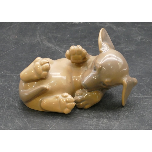 13 - A Royal Copenhagen figure of a puppy lying on its back, 1408, 11cm long.