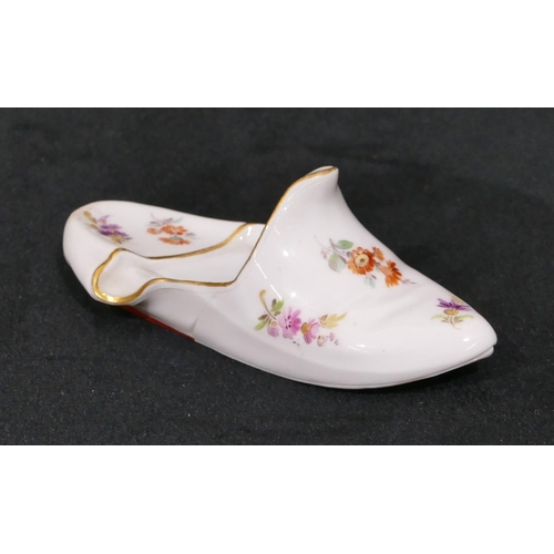 134 - A Meissen porcelain miniature slipper with allover multi-coloured floral, leaf and gilt decoration, ... 