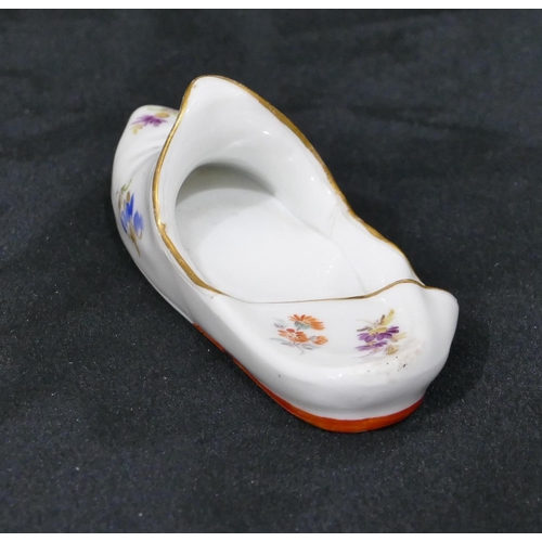 134 - A Meissen porcelain miniature slipper with allover multi-coloured floral, leaf and gilt decoration, ... 