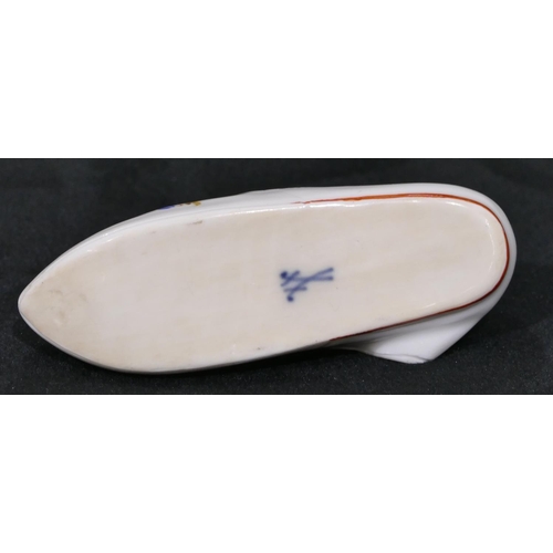 134 - A Meissen porcelain miniature slipper with allover multi-coloured floral, leaf and gilt decoration, ... 