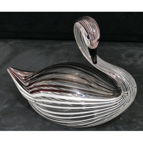 137 - A Lauretta glass figure of a swan on clear ground with striped decoration, 25cm long, 19cm high.