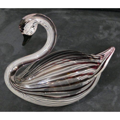 137 - A Lauretta glass figure of a swan on clear ground with striped decoration, 25cm long, 19cm high.