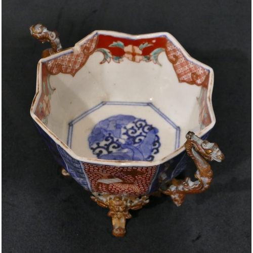 143 - A 19th Century Oriental Imari pattern octagonal shaped bowl with crinkled rim, mounted in gilt metal... 