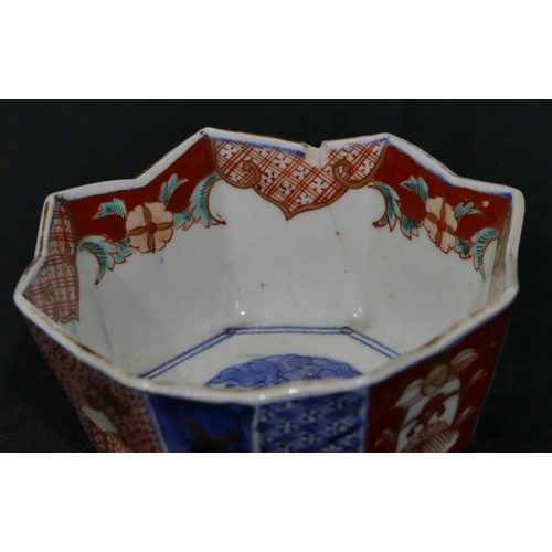 143 - A 19th Century Oriental Imari pattern octagonal shaped bowl with crinkled rim, mounted in gilt metal... 