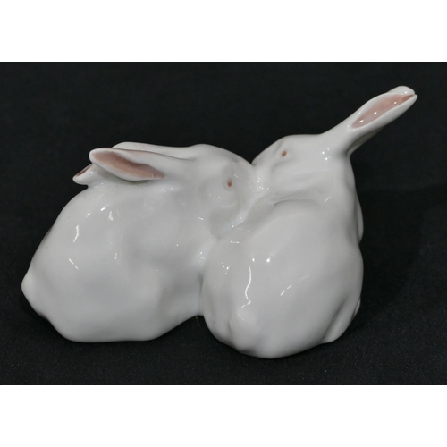 151 - A Royal Copenhagen white china group of 2 rabbits, number 518, 11cm wide