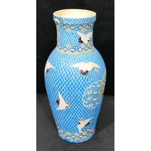 153 - A Japanese round bulbous thin necked vase on turquoise ground with coloured crane, floral, leaf and ... 