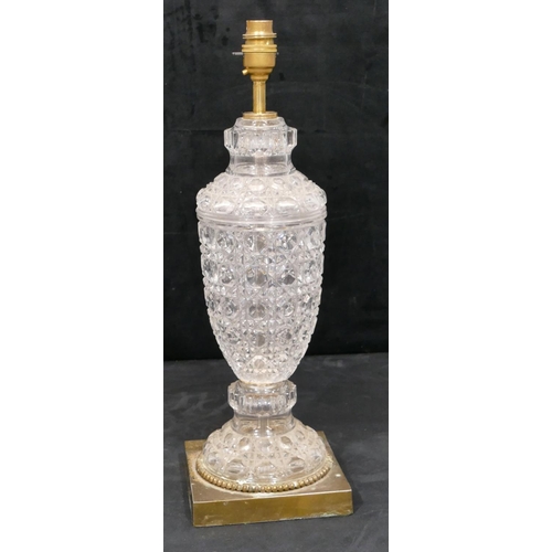 157 - A heavy cut glass and gilt metal round bulbous think necked table lamp on square base, 46cm high