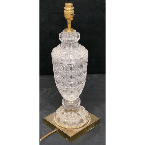 157 - A heavy cut glass and gilt metal round bulbous think necked table lamp on square base, 46cm high