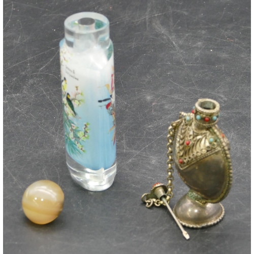 16 - An oval glass Oriental snuff bottle with stopper with inner painted bird, branch and floral decorati... 