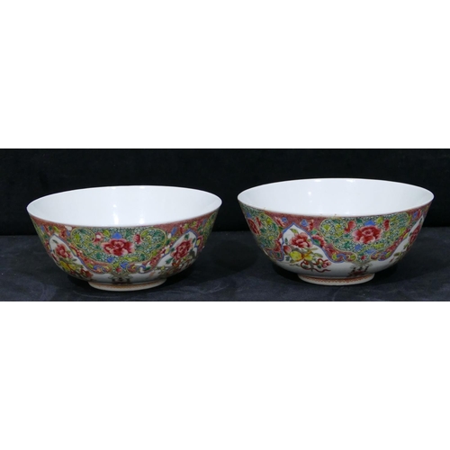 160 - A pair of Chinese Daogtang period round bowls on white ground with allover multi-coloured jardienier... 