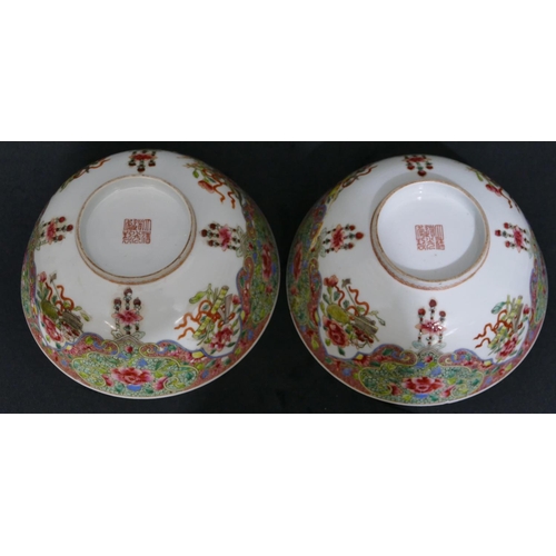 160 - A pair of Chinese Daogtang period round bowls on white ground with allover multi-coloured jardienier... 