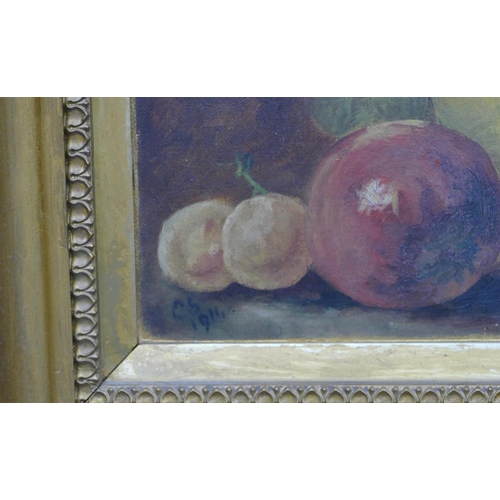 170 - An early 20th Century still life oil on canvas depicting fruit, initialed CS and dated 1911, in gilt... 