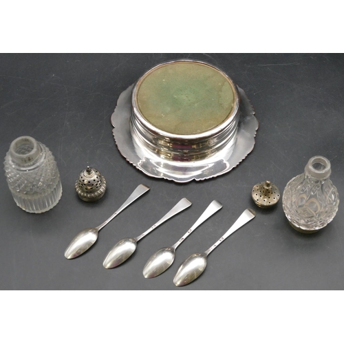 212 - 4 odd silver teaspoons, a cut glass pepperpot with Georgian silver top, another cut glass pepperpot ... 