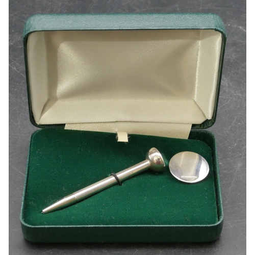 213 - A modern London silver circular golf marker and matching pencil/tee (boxed)