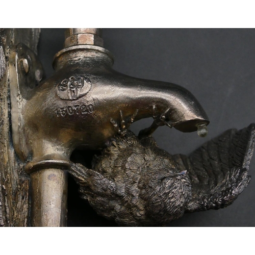 216 - A modern Comyns silver mounted (filled) model of a Blue Tit perched on a tap, 15.2cm high.