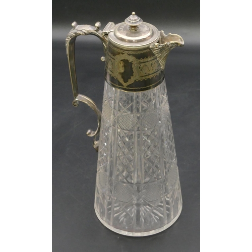 217 - A cut glass claret jug with silver plated neck, hinged lid and scroll handle, 28cm high