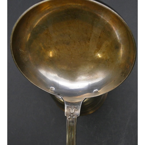 223 - An Continental soup ladle with raised shell and swag handle, a similar round trumpet shaped beaker a... 