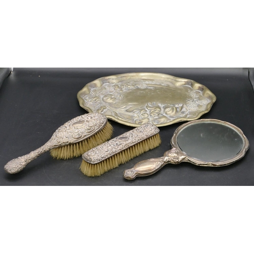 224 - A Birmingham silver hand mirror with embossed floral and scroll decoration (pin holes allover), a Bi... 