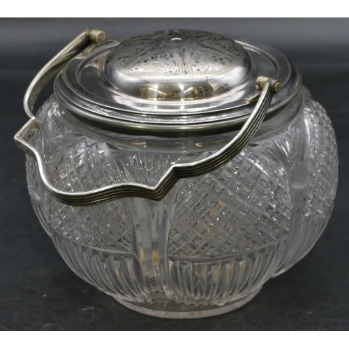 225 - A cut-glass round bulbous shaped biscuit barrel with silver plated neck, cover and swing overhead ha... 