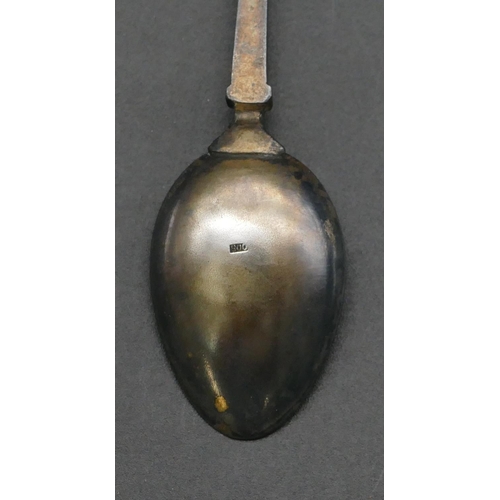 226 - An 800 silver coloured metal enamelled teaspoon with bowl depicting figures on camels in market plac... 