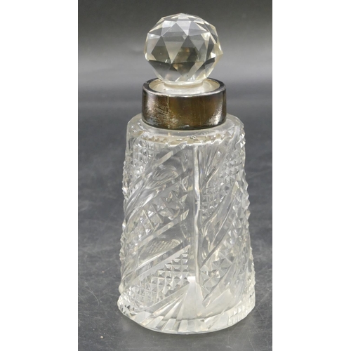 228 - A cut glass round scent bottle with stopper and Birmingham silver neck, 14cm high.