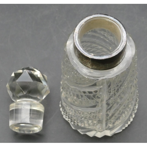 228 - A cut glass round scent bottle with stopper and Birmingham silver neck, 14cm high.