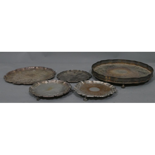 232 - A silver plated round scallop shaped tray with pierced gallery on splayed claw and ball feet, 35.2cm... 