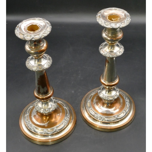 233 - A pair of 19th Century Sheffield plated candlesticks on turned stems with round sweeping bases, part... 