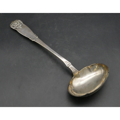 235 - An 830 silver coloured metal Continental soup ladle with embossed floral bud and scroll decoration, ... 