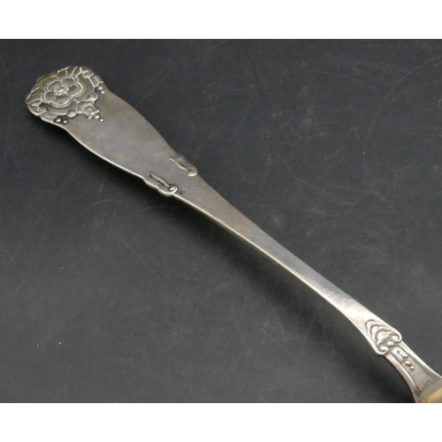 235 - An 830 silver coloured metal Continental soup ladle with embossed floral bud and scroll decoration, ... 