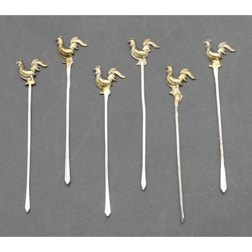 237 - A set of 6 Continental silver gilt coloured metal cocktail sticks with cockerel motifs, in fitted br... 