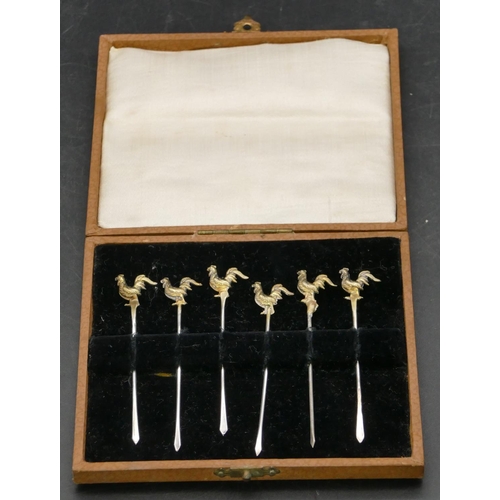 237 - A set of 6 Continental silver gilt coloured metal cocktail sticks with cockerel motifs, in fitted br... 