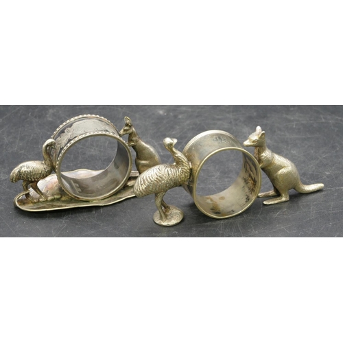 238 - An Australian Stewart Dawson & Co. silver plated napkin ring supported by kangaroo and emu, 11.5m wi... 